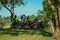 Parked motorcycles under shade in countryside