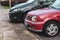 Parked red Nissan Micra