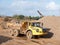 Parked yellow quarry tipping truck construction big wheels