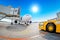Parking at the airport, airplane at the teletrap. Aerodrome tractor is ready for towing and departure of the aircraft. Against the