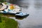 Parking catamarans on the city beach in summer. The river bank. boat rental