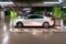Parking garage blurred. Empty road asphalt background in soft focus. Car lot parking space in underground city garage