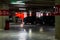 Parking garage interior with a few parked cars. Underground parking garage in Bucharest, Romania, 2021