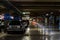 Parking garage interior with a few parked cars. Underground parking garage in Bucharest, Romania, 2021