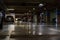 Parking garage interior with a few parked cars. Underground parking garage in Bucharest, Romania, 2021