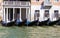 Parking gondolas on the pier in Grand Canal