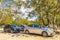 Parking lot with cars jungle to Kaan Luum lagoon Mexico