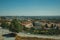 Parking lot on top of hill with apartments in a housing complex