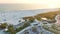 Parking lot for tourists cars in front of famous Siesta Key beach with soft white sand in Sarasota, USA at sunset