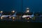 Parking of passenger aircraft at the airport. Evening rain