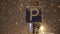 Parking sign in the snow in slow motion