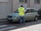 Parking warden issuing a parking rule violation on a mobile app in Lombardy, Italy
