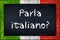 Parla italiano blackboard with italy flag frame