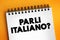 Parli Italiano? do you speak Italian? text on notepad, concept background