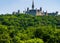 parliament hill surrounded by green forest ai