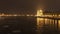 Parliament at nighttime with icy Danube