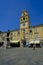 Parma, Italy: Piazza, square Garibaldi government building on sunny day. Repairing clock on the town square. Garibaldi statue