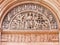 Parma - The romanesque relief of Jesus Christ among the angels and twelv apostles on the portal of Baptistery.