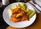 Parmesan breaded chicken schnitzel with potatoes and pickles