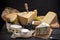 Parmesan, brie, caciotta, camambert and other cheese with pear and honey on wooden table