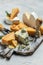 Parmesan. Cheeses set dor blu chedar camamber brie. Different types of cheese with knife on a light background. place for text,