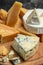 Parmesan. Cheeses set dor blu chedar camamber brie. Different types of cheese with knife on a light background. place for text,