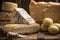 Parmesan, taleggio, caciotta and asolo cheese on dark wooden table