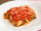 Parmigiana, Italian food with eggplant, tomato and cheese.