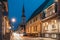 Parnu, Estonia. Night Puhavaimu Street With Old Wooden Houses, Restaurants, Cafe, Hotels And Shops In Evening Night