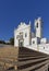 The Paropquia de S Martinho high up on some terraced cobbled steps in the town centre of Estoi .