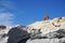 Paros, Greece, September 14 2018, A tourist looks at Kolimbithres beach sitting on a rock formation