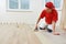 Parquet worker adding glue on floor