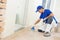 Parquet worker adding glue on floor