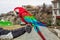 Parrot Ara red-green in the city of Tbilisi.