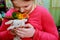 Parrot bird on young girl hand Environment human and nature concept Smiling playing with her bird pet.