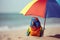 Parrot under an umbrella on the beach in sunny weather is resting