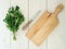 Parsley, kitchen knife and wooden cutting board