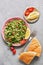 Parsley salad or Tabbouleh. Easy and healthy vegetarian dish with bulgur, tomatoes, parsley, spring onion and mint, olive oil on g