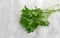 Parsley sprigs on a marble cutting board