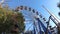 Part of attractions. Ferris wheel in summer on a sunny day