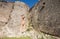 Part of the bastion of an ancient castle. Powerful fortification in the middle of the castle. High ancient walls in the castle.