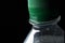 Part of bottle with sparkling water in rotationPlastic bottle with a cap in rotation