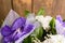 Part of bouquet with orchid on wooden background