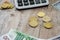 Part of the calculator, euro, dollars and coins on a wooden background