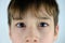 Part of the child`s face, boy 10-12 years old, sad, anxious face of teenager, stress problems, difficult childhood, victim of