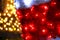 Part of Christmas decorative red, white, yellow, golden flashing lights. Detail of New Year and Christmas decorations.
