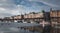 Part of city pier in winter with moored boats