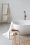 Part of classic bathtub in modern interior bathroom