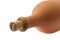 Part of a clay bottle closed with a cork on a white background.