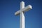 Part of a cross displayed in front of blue sky background in Chacabuco, Valley of Los Andes, Chile.